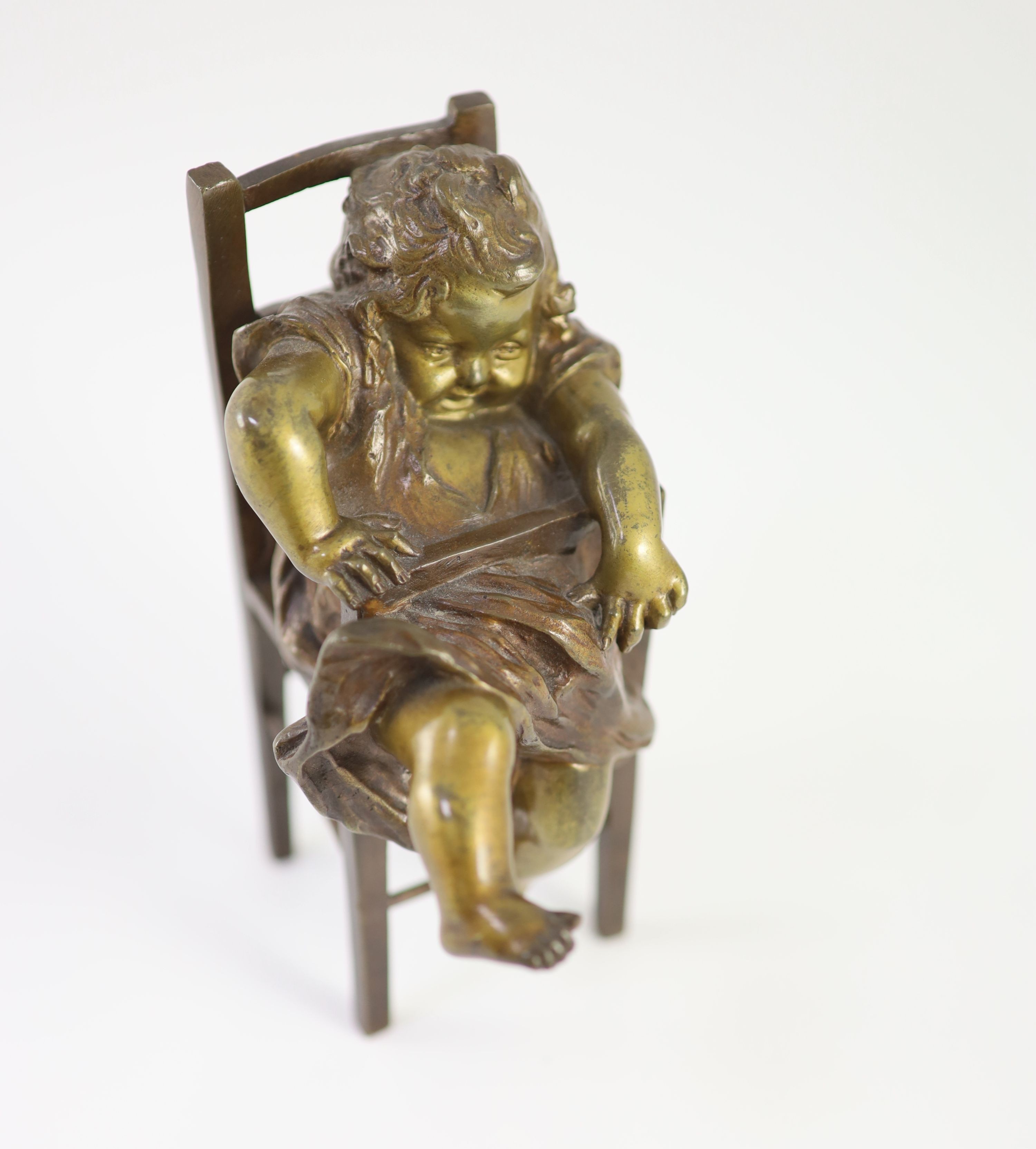 After Joan Clarà (1875 - 1958). A pair of bronze models of girls playing on chairs, height 15.5cm